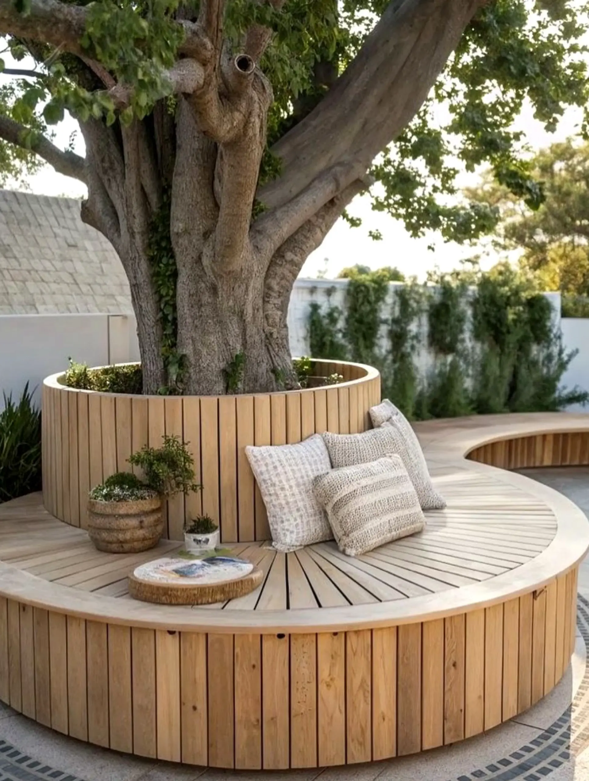 Graceful garden seating adds comfort across the entry, giving the decor a finish that feels soft at the edges.