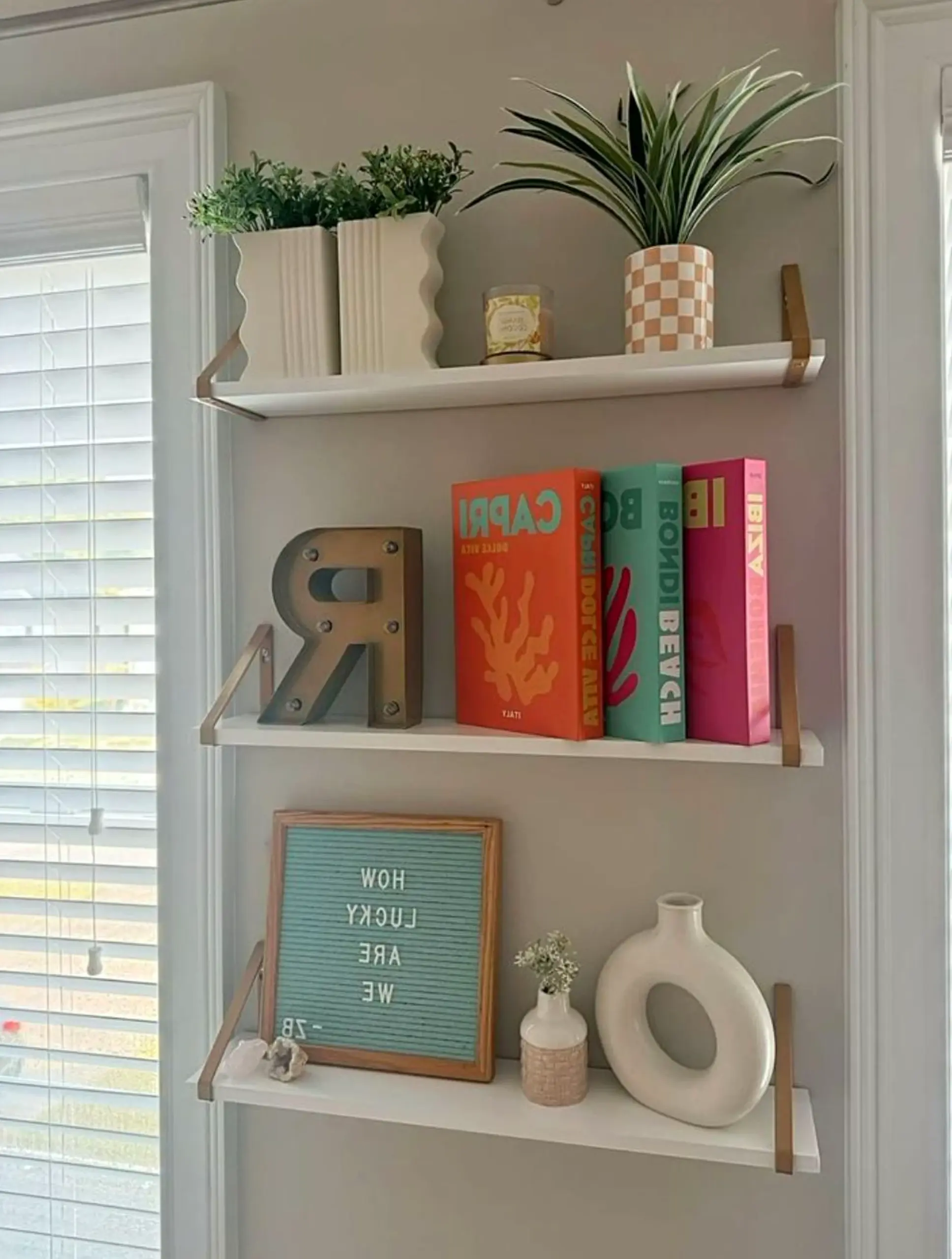 Inviting kitchen nook anchors the wall with comfort, giving the view a mood that feels bright but not busy.