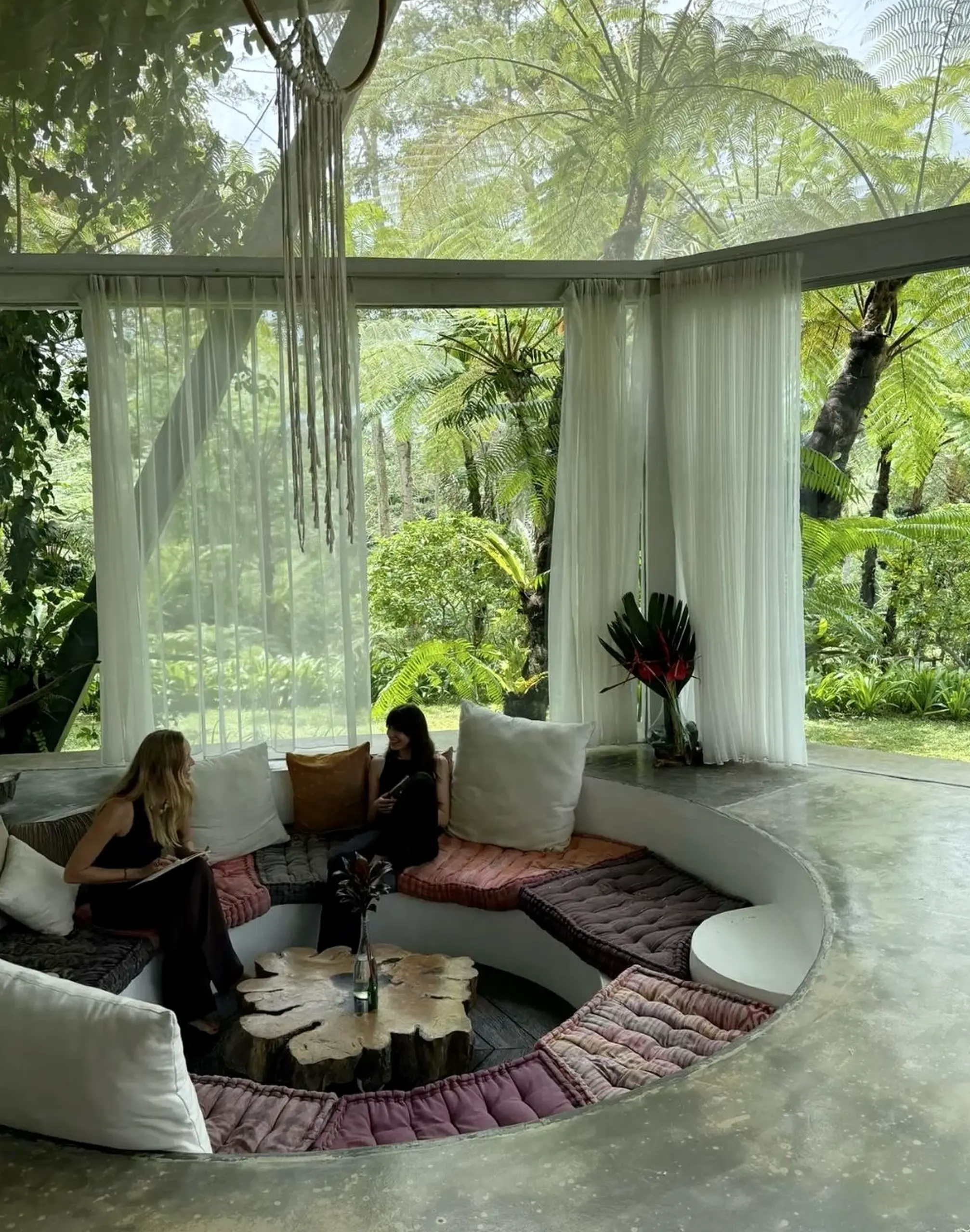 Airy balcony scene adds a clear layer of depth, helping the composition feel open and lived-in.