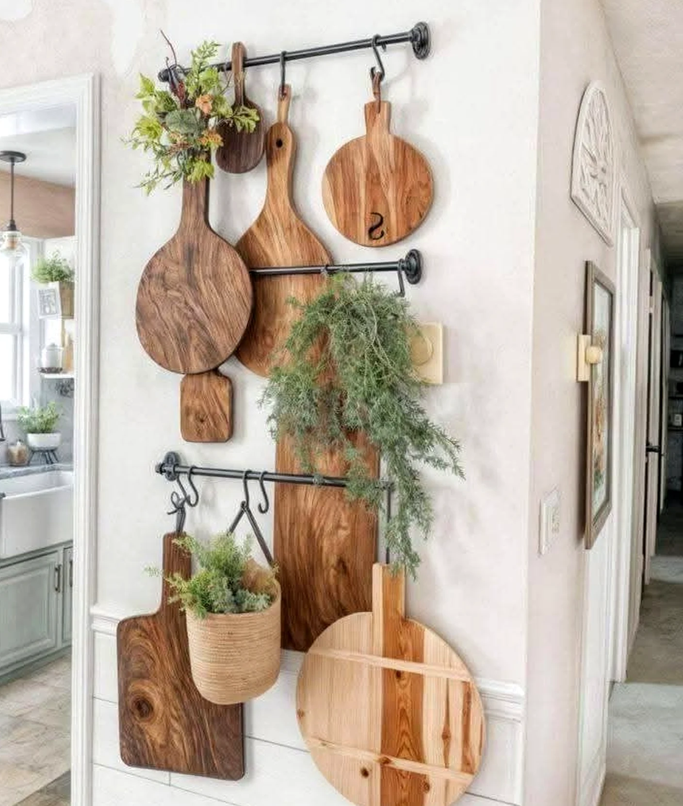 Leafy balcony scene anchors the arrangement with texture, giving the view a mood that feels warm without clutter.