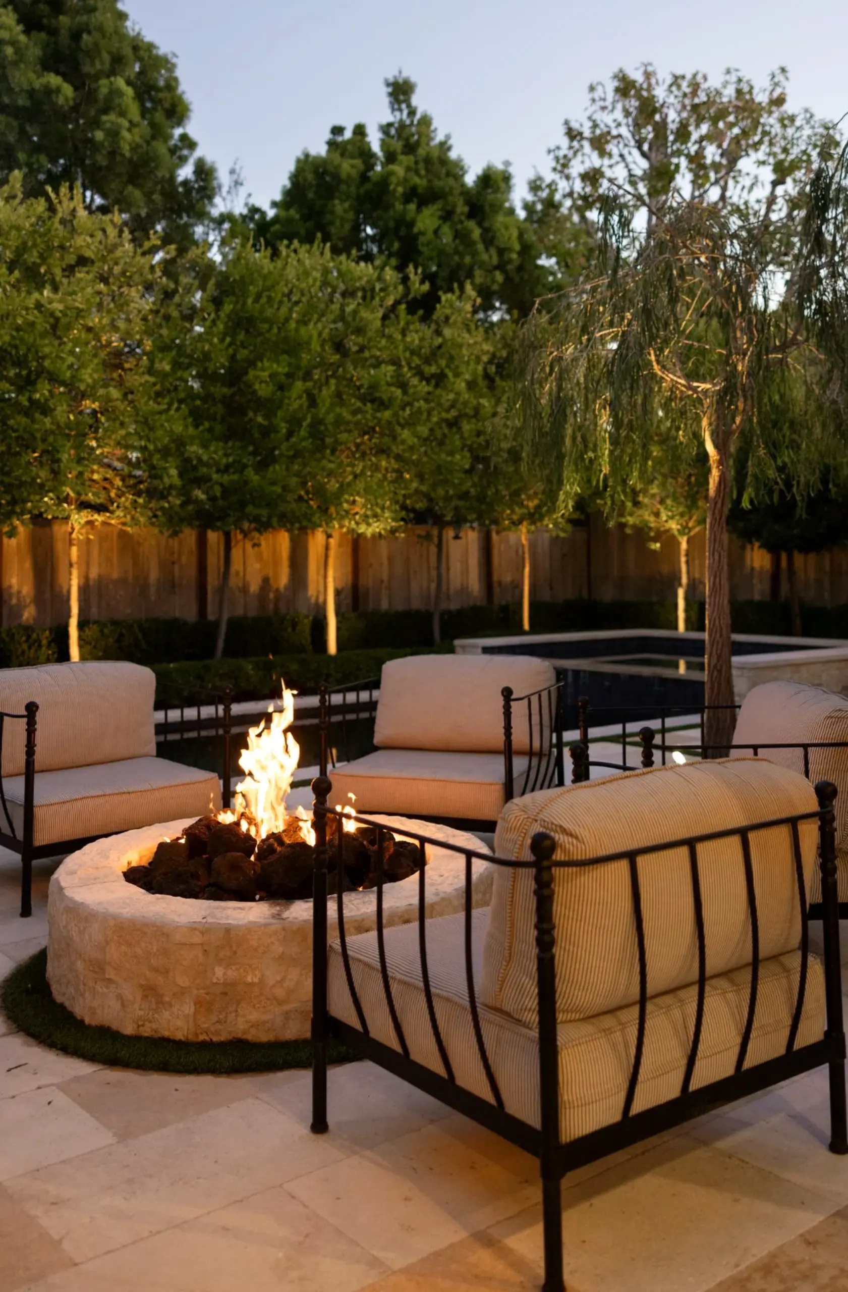 Tactile lamp detail anchors the sitting area with charm, giving the view a mood that feels ready for quiet use.