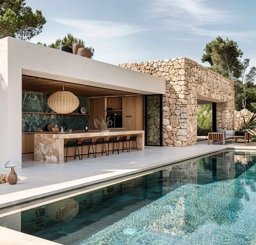 Sculptural flower arrangement frames the outdoor space with light, making the scene feel bright but not busy.