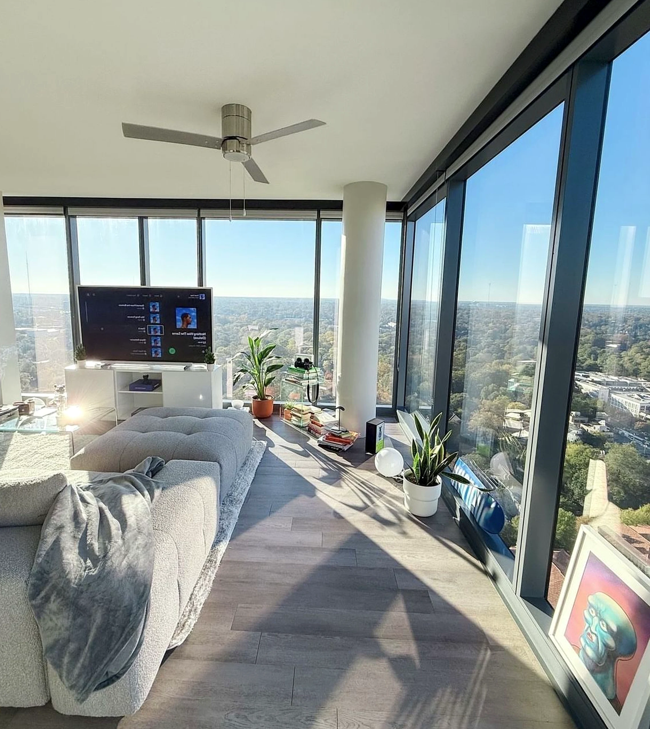 Inviting sunlit room brings personality to the corner, creating a mood that feels open and lived-in.