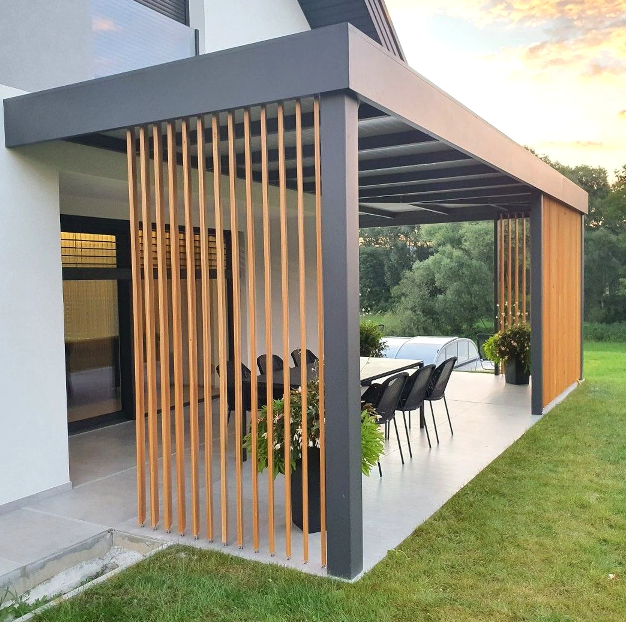 Elegant wooden deck supports the design through contrast, leaving the space feeling quietly finished.