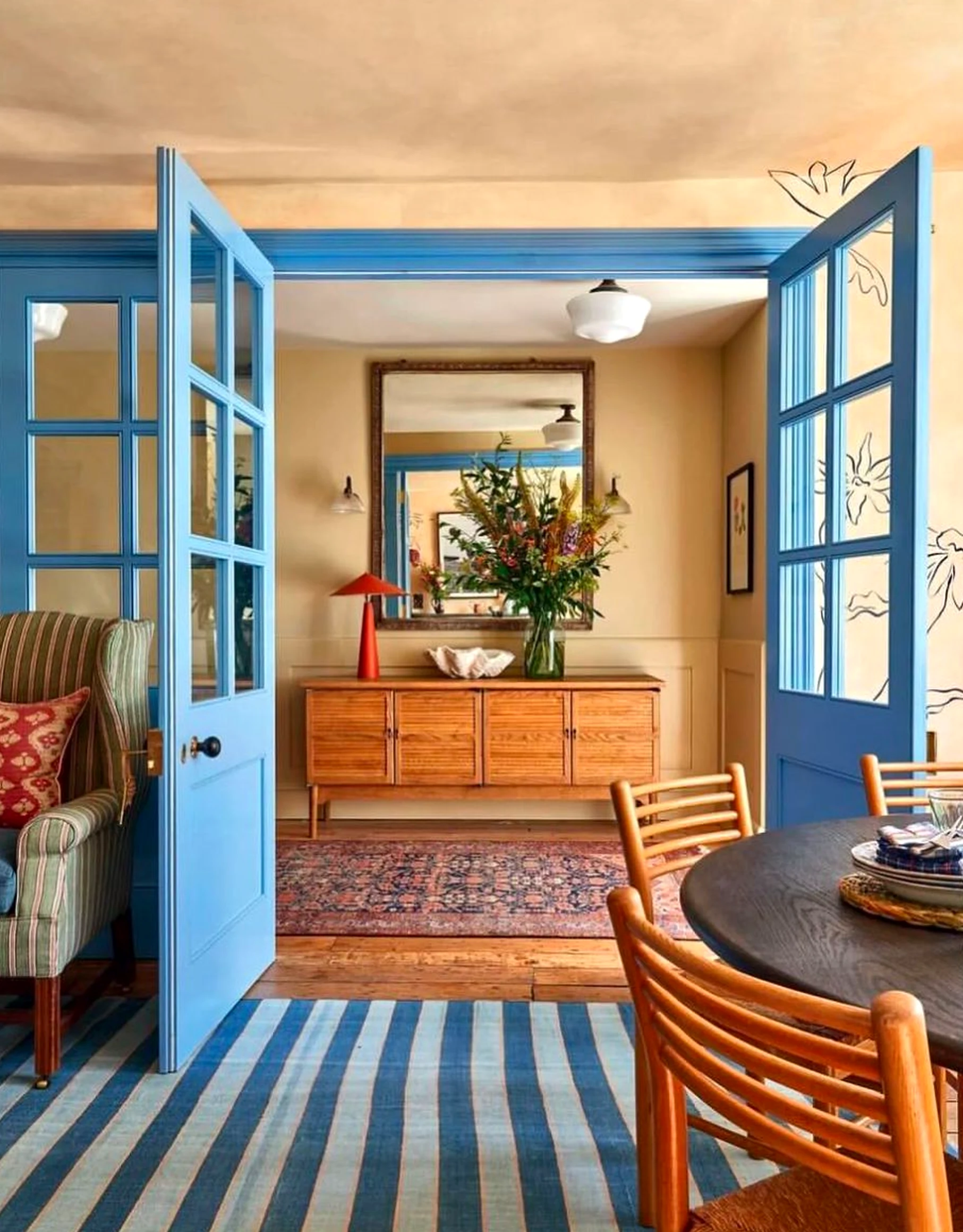 Bright arched doorway brings a useful note of personality, making the sitting area feel ready for quiet use.